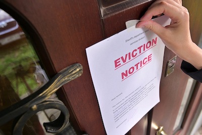Houston property owner placing an eviction notice on a home before having to perform an eviction clean out
