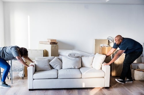 A couple wanting to throw away old furniture for free during a move