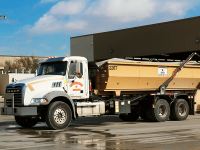 Roll-off dumpster leaving an event venue