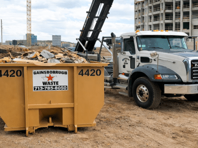 Gainsborough Waste dumpster and haulaway truck positioned at a construction site in Houston, Texas